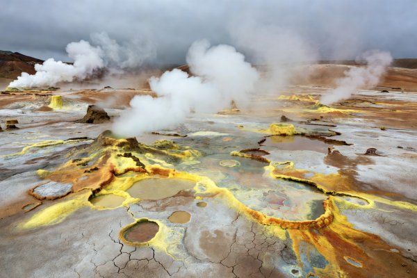Steaming vents and sulphur-stained clay pools at Hverir geothermal area