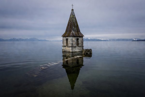 14th-century submerged church spire in the middle of Reschensee lake